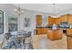 Bright kitchen featuring an island, breakfast nook, and wood cabinets at 13853 Siena Loop, Lakewood Ranch, FL 34202