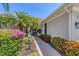 Inviting entryway with lush landscaping and a brick walkway leading to the front door at 13853 Siena Loop, Lakewood Ranch, FL 34202