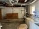 Basement with laundry hookups, storage, and work area at 6613 Blue Heron S Dr, St Petersburg, FL 33707