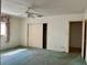 Bedroom with carpeting, closet and doorway, offering comfortable living space at 6613 Blue Heron S Dr, St Petersburg, FL 33707