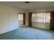 Bedroom with carpet, neutral paint, and large windows offering ample natural light at 6613 Blue Heron S Dr, St Petersburg, FL 33707