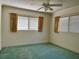Bedroom with carpet, a ceiling fan and natural light coming through the window at 6613 Blue Heron S Dr, St Petersburg, FL 33707