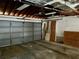 A spacious garage with wood details provides parking and storage at 6613 Blue Heron S Dr, St Petersburg, FL 33707
