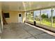 Screened-in patio offers an outdoor space for relaxation or entertainment with views of the backyard at 6613 Blue Heron S Dr, St Petersburg, FL 33707