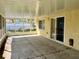 Screened-in patio offers an outdoor space for relaxation or entertainment with views of the backyard at 6613 Blue Heron S Dr, St Petersburg, FL 33707