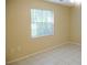 Bright bedroom with tile floors and a window at 2411 Aspinwall St # 2411, Sarasota, FL 34237