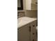 Bathroom vanity with white countertop and gray cabinets at 2411 Aspinwall St # 2411, Sarasota, FL 34237