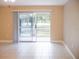 Bright living room with water view, featuring comfortable seating and large sliding glass doors at 2411 Aspinwall St # 2411, Sarasota, FL 34237
