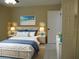 Virtually staged bedroom with wicker bed frame and coastal decor at 2411 Aspinwall St # 2411, Sarasota, FL 34237
