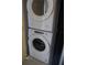 Laundry room with stackable washer and dryer at 2411 Aspinwall St # 2411, Sarasota, FL 34237