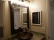Bathroom with a vessel sink, updated vanity, and large mirror at 2411 Aspinwall St # 2411, Sarasota, FL 34237
