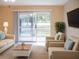 Comfortable living room with water views, featuring sofas and a coffee table at 2411 Aspinwall St # 2411, Sarasota, FL 34237
