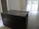 Kitchen island with granite countertop and ample storage at 2411 Aspinwall St # 2411, Sarasota, FL 34237