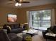 Virtually staged living room, featuring modern furniture and water views at 2411 Aspinwall St # 2411, Sarasota, FL 34237