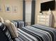 Bedroom with twin beds and coastal-themed decor at 395 Aruba Cir # 102, Bradenton, FL 34209