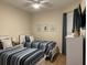 Bedroom with twin beds, coastal decor, and TV at 395 Aruba Cir # 102, Bradenton, FL 34209