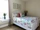 Guest bedroom with a full-size bed and coastal decor at 395 Aruba Cir # 102, Bradenton, FL 34209