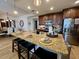 Modern kitchen with granite countertops, stainless steel appliances, and island at 395 Aruba Cir # 102, Bradenton, FL 34209