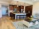 Open concept kitchen with island and seating overlooking living area at 395 Aruba Cir # 102, Bradenton, FL 34209