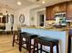 Modern kitchen island with granite countertops and seating for four at 395 Aruba Cir # 102, Bradenton, FL 34209