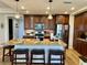 Modern kitchen with granite countertops, stainless steel appliances, and breakfast bar at 395 Aruba Cir # 102, Bradenton, FL 34209