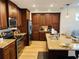 Spacious kitchen with ample cabinetry, granite counters, and stainless steel appliances at 395 Aruba Cir # 102, Bradenton, FL 34209