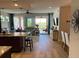 Open living space with hardwood floors, large windows and access to balcony at 395 Aruba Cir # 102, Bradenton, FL 34209