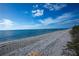 Scenic beach view with pristine white sand and calm waters at 7730 Manasota Key Rd, Englewood, FL 34223