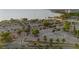 Aerial view of spacious parking lot with palm trees at 750 N Tamiami Trl # 1115, Sarasota, FL 34236