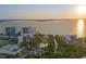 Wide aerial view of waterfront area at sunset at 750 N Tamiami Trl # 1115, Sarasota, FL 34236