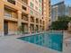 Refreshing community pool with ample deck space for sunbathing at 750 N Tamiami Trl # 1115, Sarasota, FL 34236