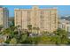 High rise building with balconies and lush landscaping at 750 N Tamiami Trl # 1115, Sarasota, FL 34236
