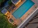Elevated view of the refreshing community pool and spa at 750 N Tamiami Trl # 1115, Sarasota, FL 34236