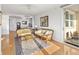 Bright living room with hardwood floors and wicker furniture at 750 N Tamiami Trl # 1115, Sarasota, FL 34236