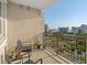 Private balcony with city views and seating at 750 N Tamiami Trl # 1115, Sarasota, FL 34236