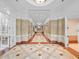 Bright and spacious lobby with tile floors and elevator access at 750 N Tamiami Trl # 1115, Sarasota, FL 34236