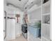 Large walk-in closet with ample shelving and storage space at 750 N Tamiami Trl # 1115, Sarasota, FL 34236