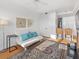 Spacious living area with a sleeper sofa and hardwood floors at 750 N Tamiami Trl # 1115, Sarasota, FL 34236