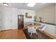 Elegant dining room with round table and built-in cabinetry at 750 N Tamiami Trl # 1115, Sarasota, FL 34236