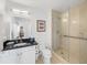 Clean bathroom with a walk-in shower and modern vanity at 750 N Tamiami Trl # 1115, Sarasota, FL 34236