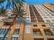 High-rise building with balconies and palm trees at 750 N Tamiami Trl # 1115, Sarasota, FL 34236
