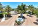 Gated entrance to community with landscaping and signage at 395 Aruba Cir # 102, Bradenton, FL 34209