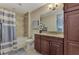 Bathroom with single vanity, granite countertop, and tub shower at 395 Aruba Cir # 102, Bradenton, FL 34209