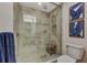 Walk-in shower with glass enclosure and tiled walls at 395 Aruba Cir # 102, Bradenton, FL 34209