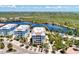 Aerial view of waterfront building, highlighting its location and parking at 395 Aruba Cir # 102, Bradenton, FL 34209