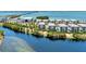 Aerial view showcasing a building in a waterfront community at 395 Aruba Cir # 102, Bradenton, FL 34209
