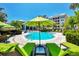 Enjoy this refreshing pool with comfortable seating and umbrellas at 395 Aruba Cir # 102, Bradenton, FL 34209