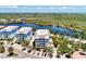 Aerial view of waterfront building showcasing its proximity to the water at 395 Aruba Cir # 102, Bradenton, FL 34209