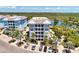Aerial view of waterfront community building with parking at 395 Aruba Cir # 102, Bradenton, FL 34209