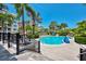 Inviting community pool with ample lounge chairs and nearby building at 395 Aruba Cir # 102, Bradenton, FL 34209